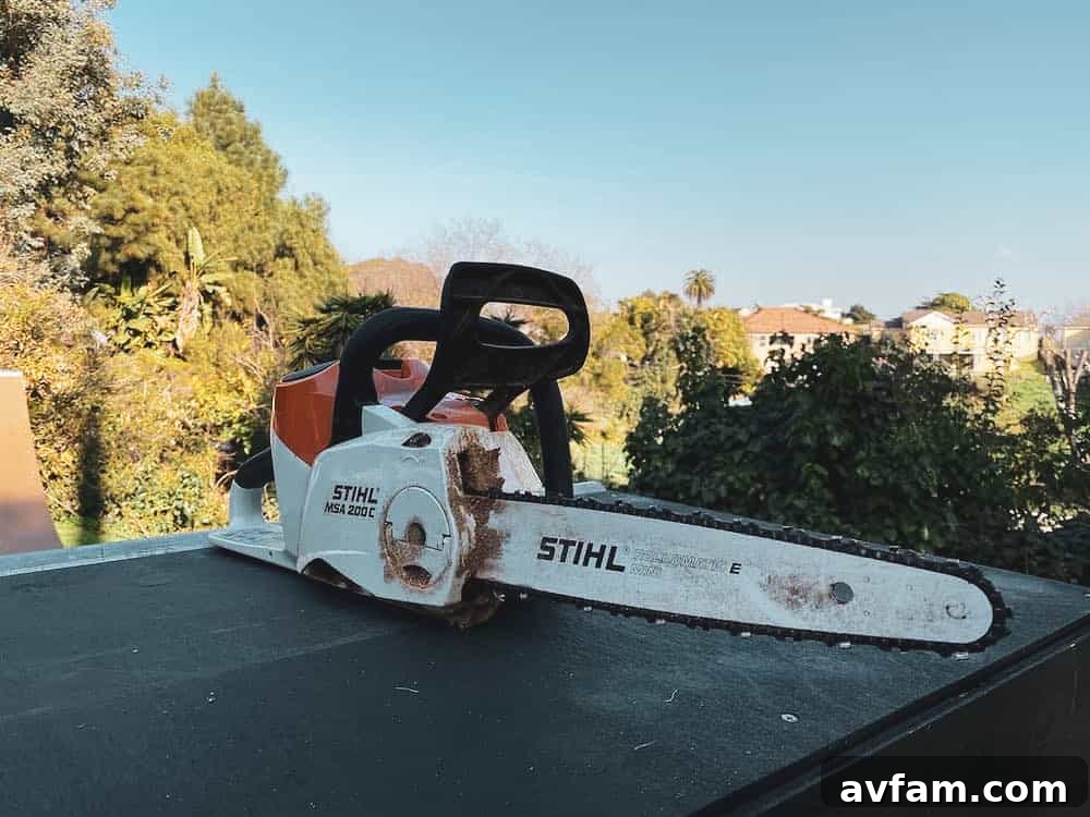 Cordless chainsaw cutting a log