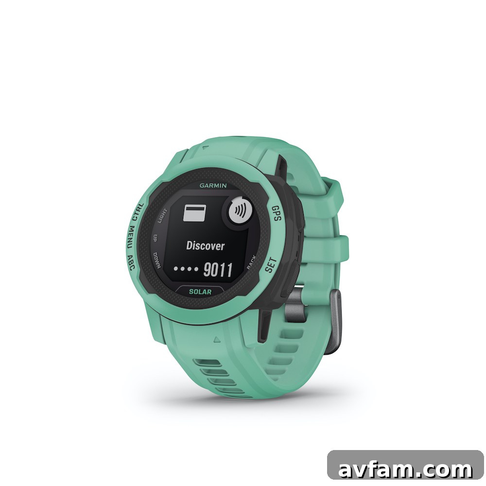 User interacting with the Garmin Instinct 2 watch on a mountain trail.