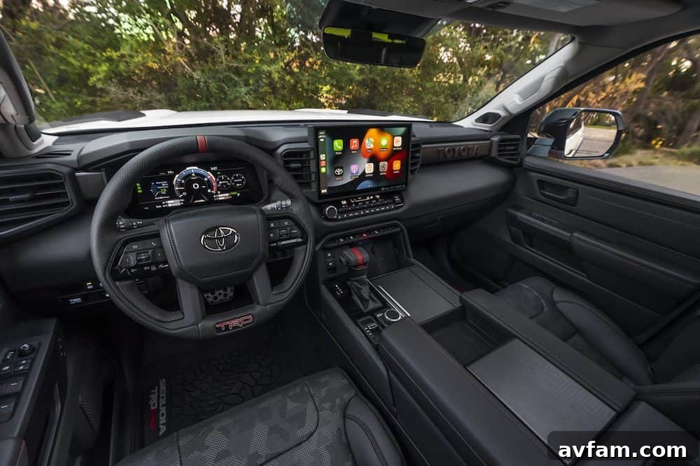 Spacious and modern interior of the 2023 Toyota Sequoia, showing the large infotainment screen and premium materials.