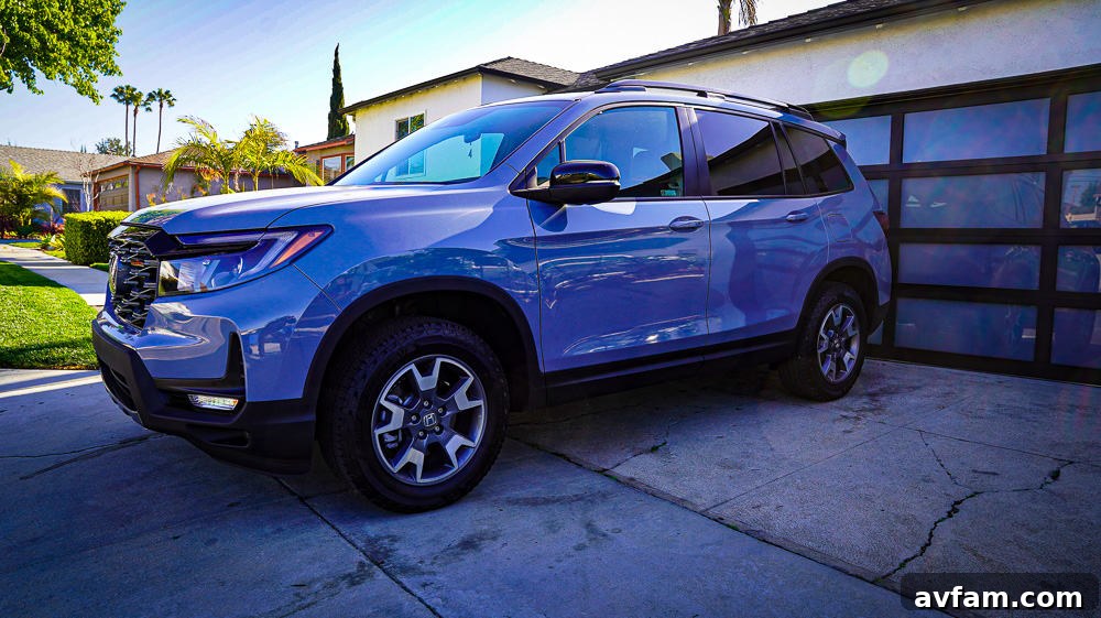 2022 Honda Passport Trailsport Front View 2022 Honda Passport Trailsport Edition parked outdoors, highlighting its robust exterior design and sporty wheels.