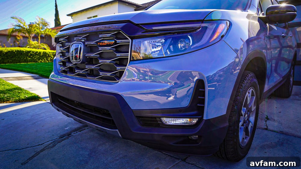 Honda Passport Profile Side view of the 2022 Honda Passport on a sunny day, showcasing its elegant profile.