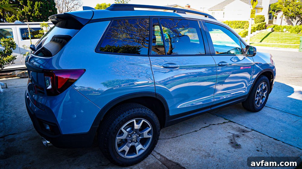 2022 Honda Passport Side View 2022 Honda Passport Trailsport Edition parked on a street, showcasing its side profile and wheel design.