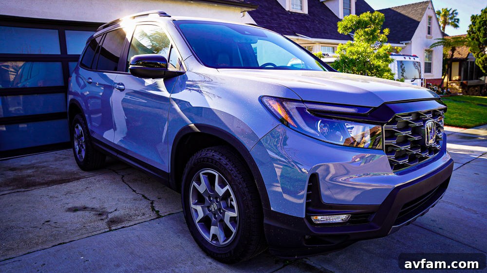 Honda Passport Front Interior Detailed view of the 2022 Honda Passport's front passenger seat and door panel.
