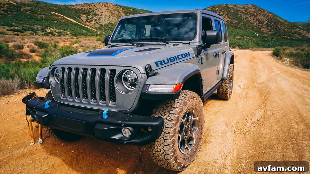 Jeep Wrangler 4XE Silent Trailblazer 15 Jeep Wrangler 4XE parked at a scenic overlook, showcasing its adventure-ready stance.