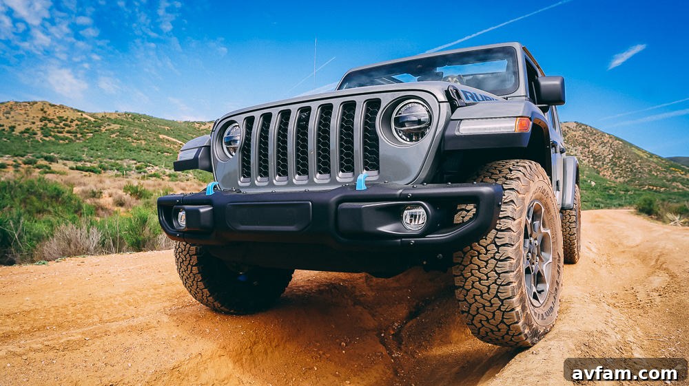 Jeep Wrangler 4XE Silent Trailblazer 18 Jeep Wrangler 4XE from a low angle, emphasizing its ground clearance and robust tires.