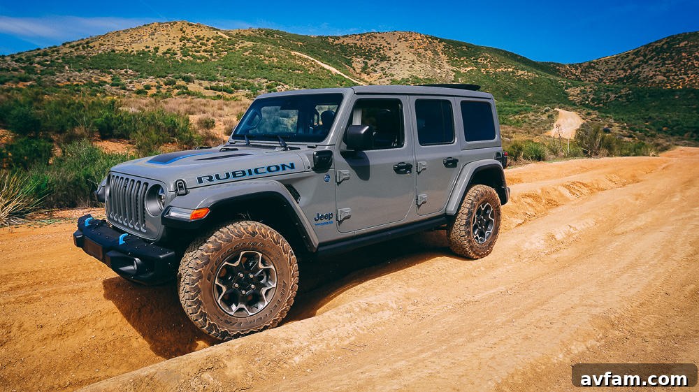 Jeep Wrangler 4XE Silent Trailblazer 25 Close-up of the Jeep Wrangler 4XE's tire on rugged terrain, showing excellent grip.