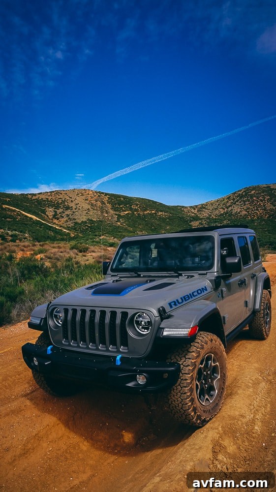 Jeep Wrangler 4XE Silent Trailblazer 28 Jeep Wrangler 4XE on a precarious rock crawl, demonstrating articulation.