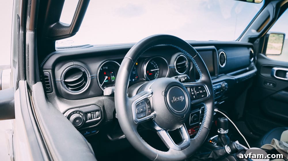 Jeep Wrangler 4XE Silent Trailblazer 10 Jeep Wrangler 4XE's interior, showing the driver's perspective on the trail.