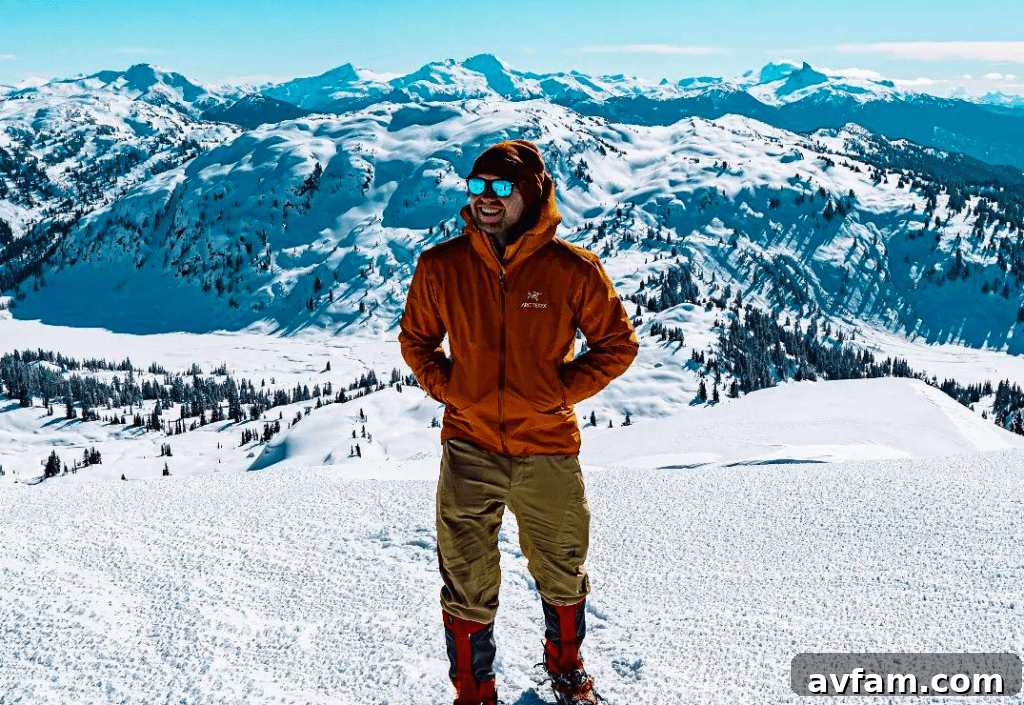 Arc'teryx Beta Jacket First Look in Snow Arc'teryx Beta jacket in a snowy mountain landscape, showcasing its sleek design and providing excellent weather protection.