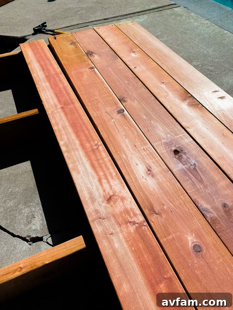 Installing deck boards with a screw spacer