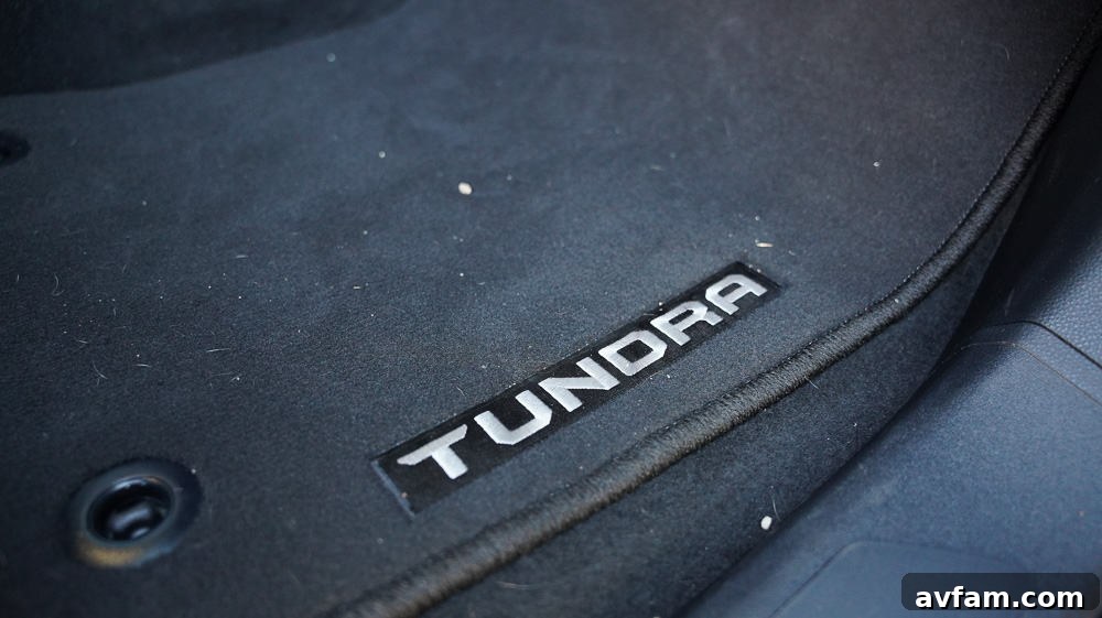 The Tundra driving through an open field, emphasizing its connection to nature and exploration.