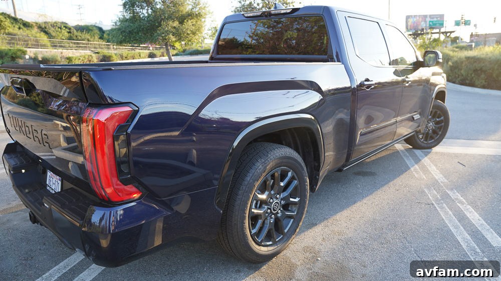 The Tundra parked by a body of water, hinting at adventurous recreational use.