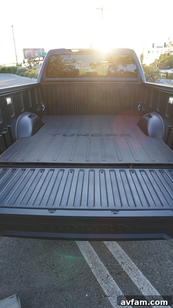 A vertical shot focusing on the Tundra's robust rear bumper and integrated hitch.