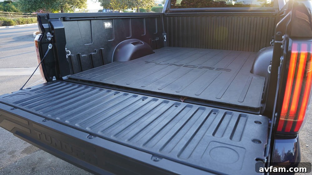 The front passenger footwell and dashboard area, showing legroom and design.