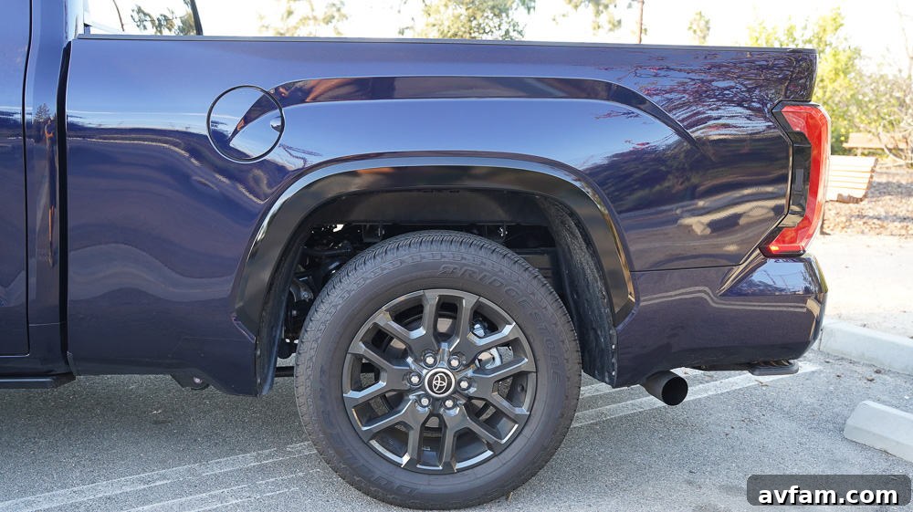 The Tundra's steering wheel with integrated controls and Toyota emblem.