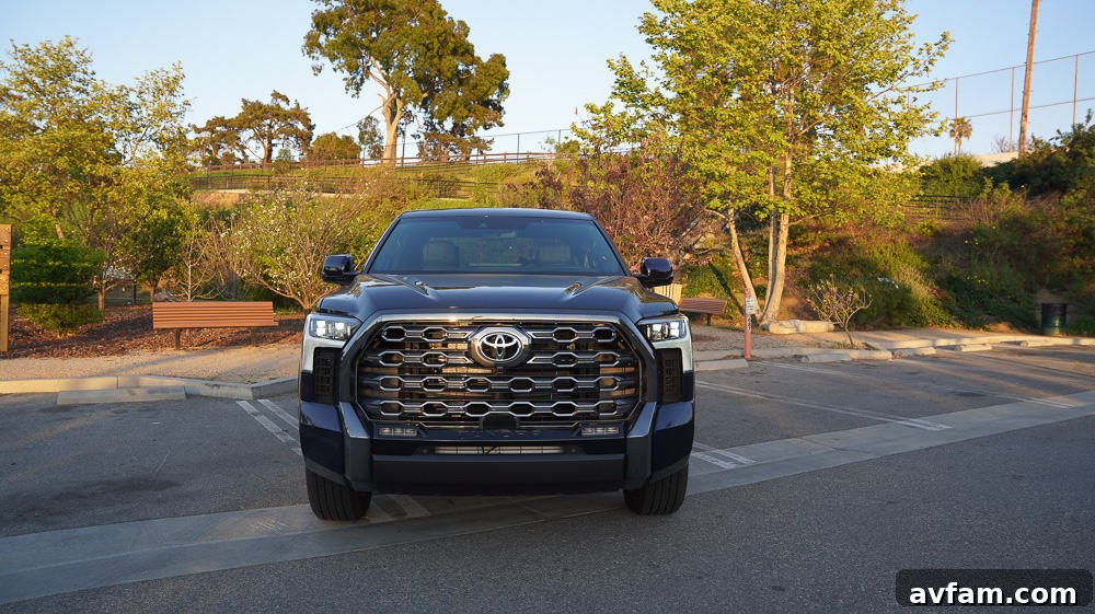 A dynamic shot of the 2022 Toyota Tundra in motion on a paved road, highlighting its redesigned body.