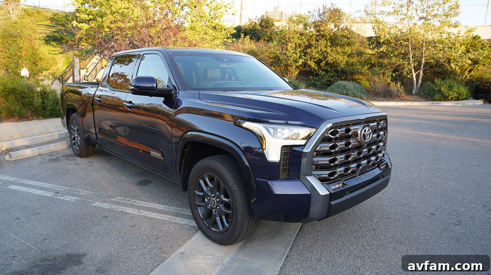 The 2022 Toyota Tundra parked on a scenic overlook, displaying its bold new styling and robust profile.
