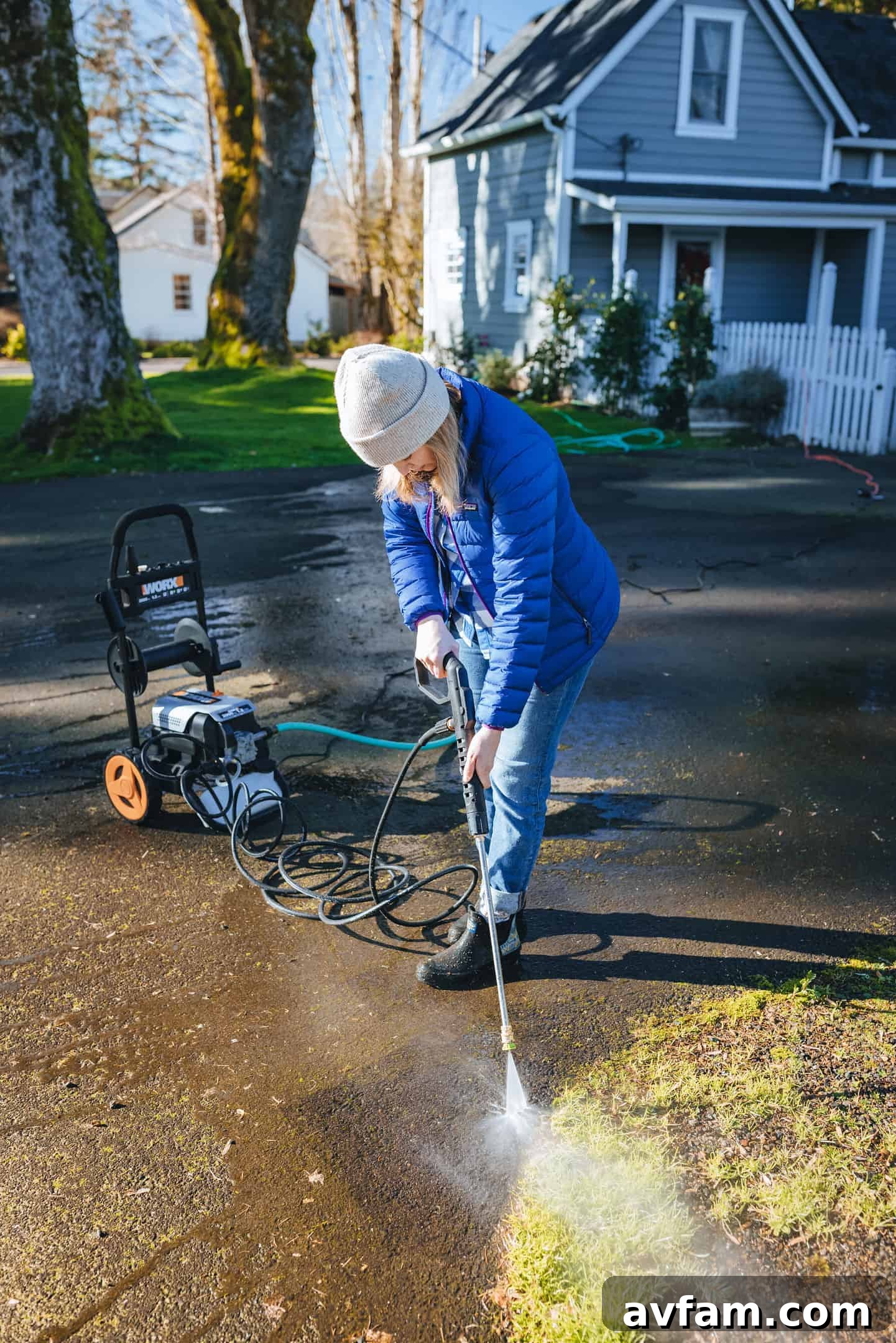 Worx 2000 PSI electric pressure washer shown with all its components neatly organized, including nozzles and hose.