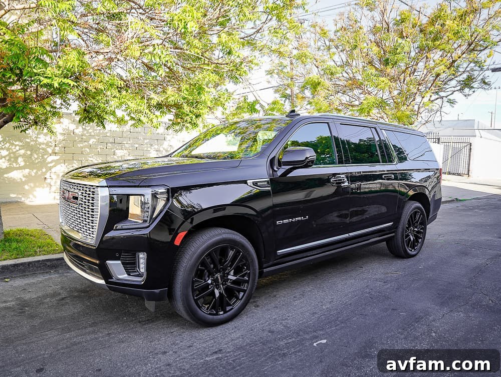 GMC Yukon XL Denali exterior front quarter view, showcasing its commanding presence and distinctive grille