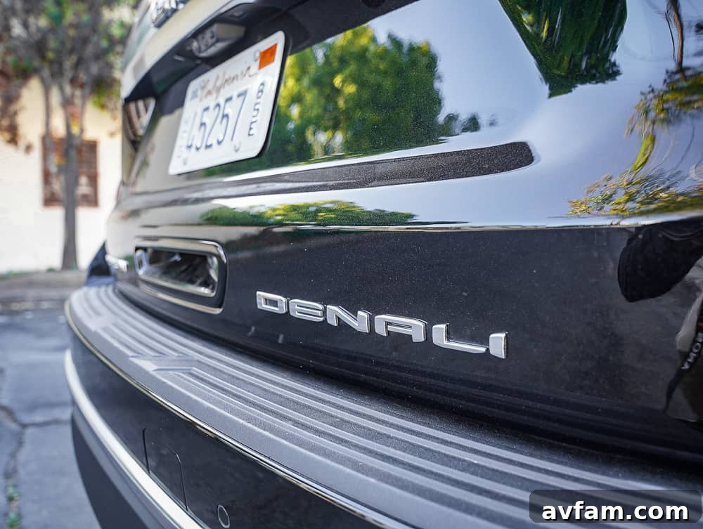 GMC Yukon XL Denali side view, highlighting the chrome accents and body lines