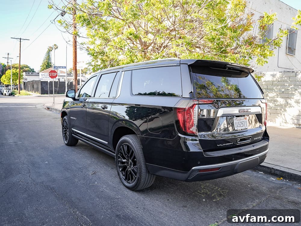 GMC Yukon XL Denali passenger side front view, in profile