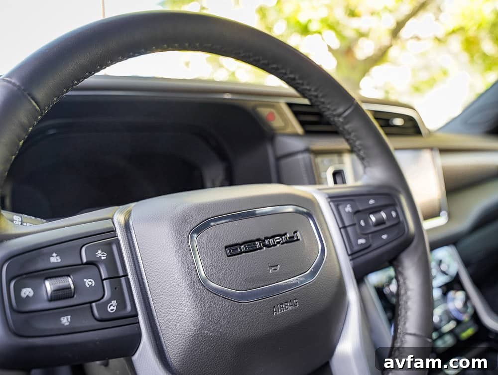 GMC Yukon XL Denali interior shot, highlighting the spacious cabin and luxurious materials