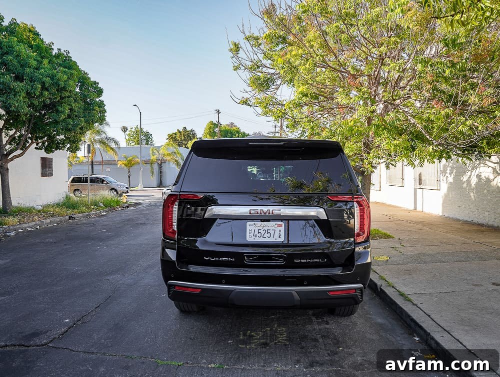 GMC Yukon XL Denali rear view, emphasizing the wide stance and taillight details