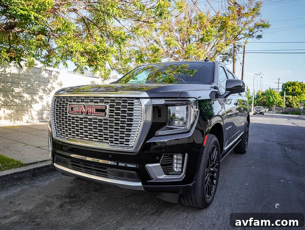 GMC Yukon XL Denali parked in a driveway, demonstrating its grandeur