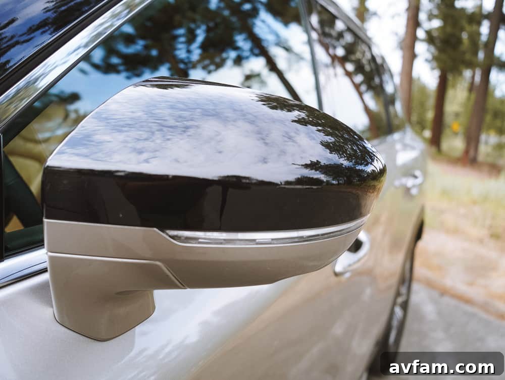 The rear design of the Infiniti QX60, featuring LED taillights and chrome accents.