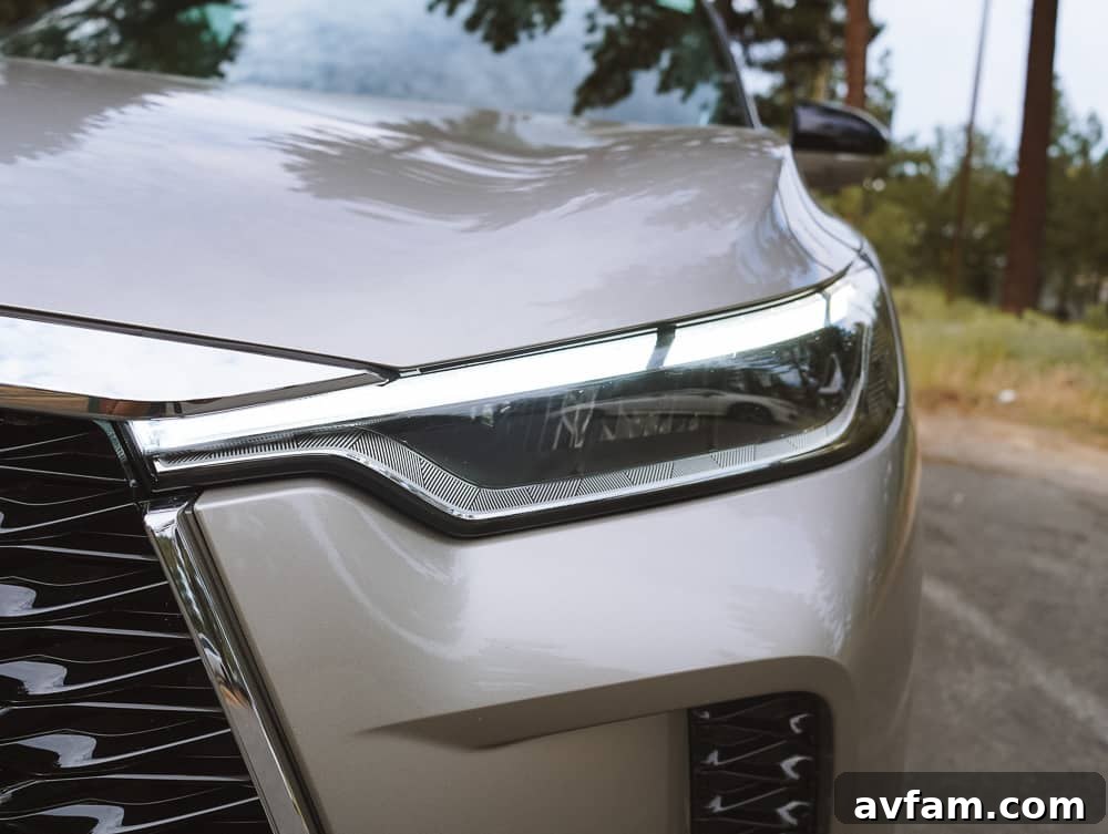 Infiniti QX60 parked with a stunning natural backdrop of Lake Tahoe.