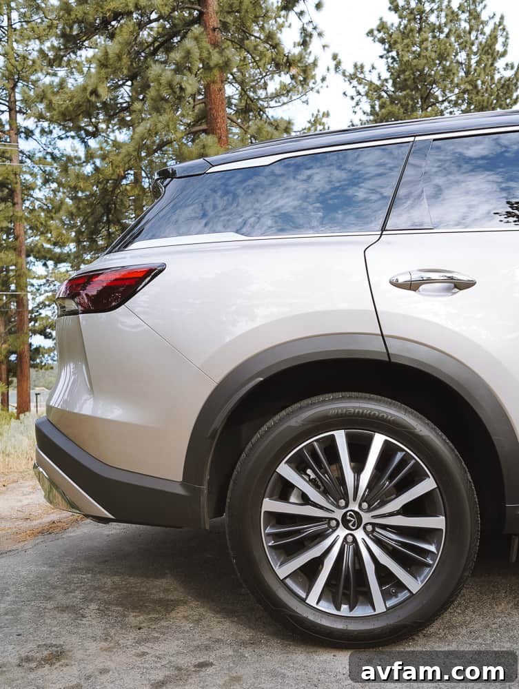 Infiniti QX60's second-row captain's chairs, showing ample space and comfort.