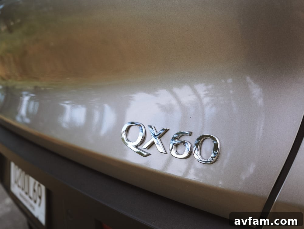 Infiniti QX60 badge on the rear, signifying its luxury status.