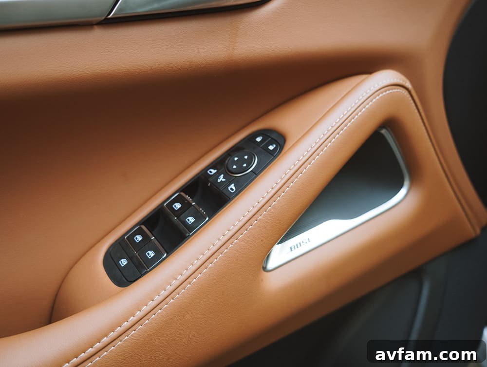 Detail of the Infiniti logo on the QX60's steering wheel.