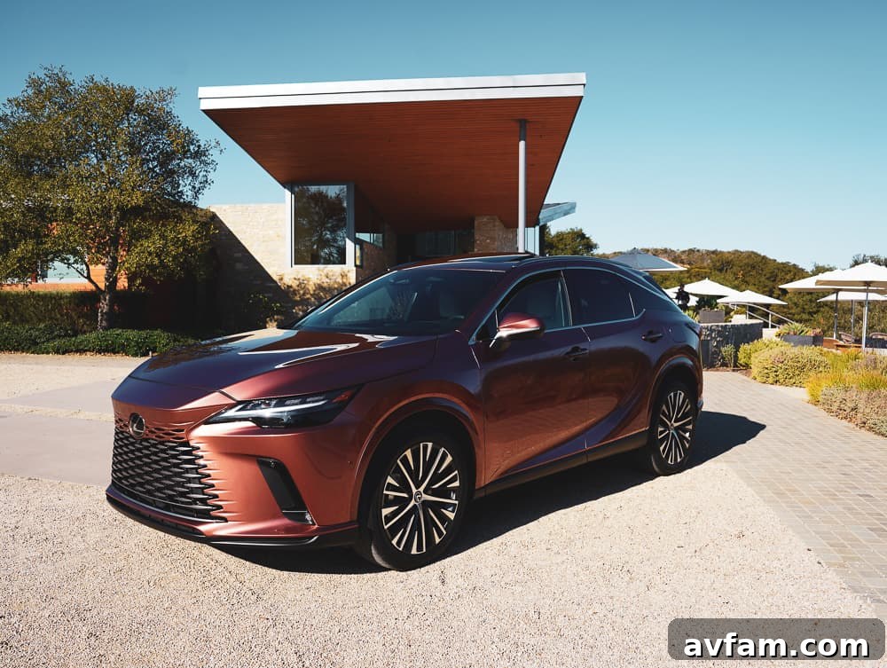 Back seat view of the 2023 Lexus RX 500h F Sport Performance, highlighting rear legroom and amenities.