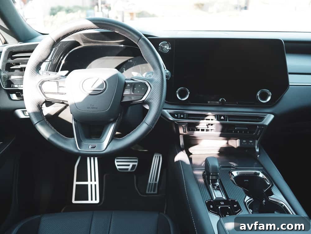2023 Lexus RX 500h F Sport Performance driving on a highway, showing its road presence.