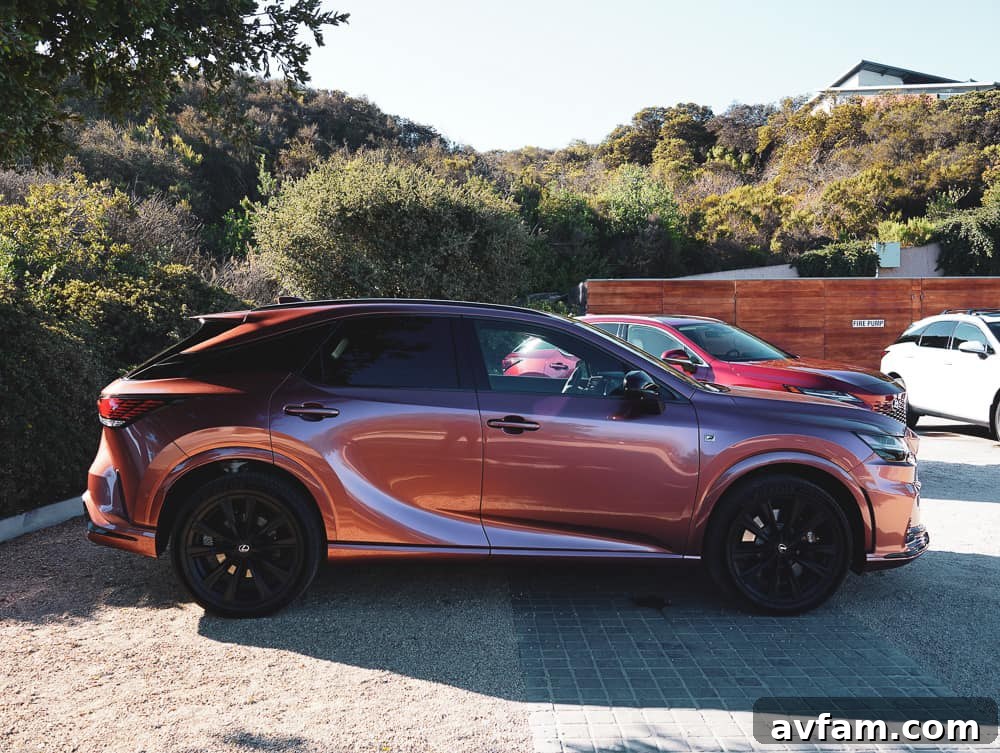 2023 Lexus RX 500h F Sport Performance in Copper Crest, parked elegantly.