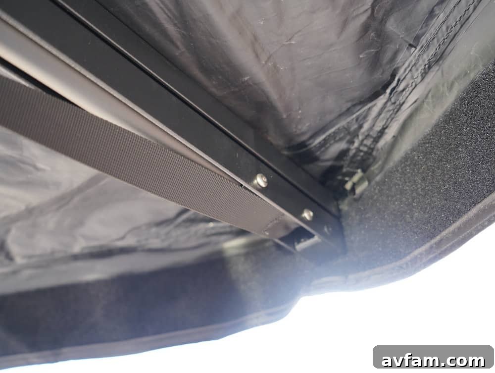 Roam ARC 270 awning protecting a vehicle and outdoor gear from the sun