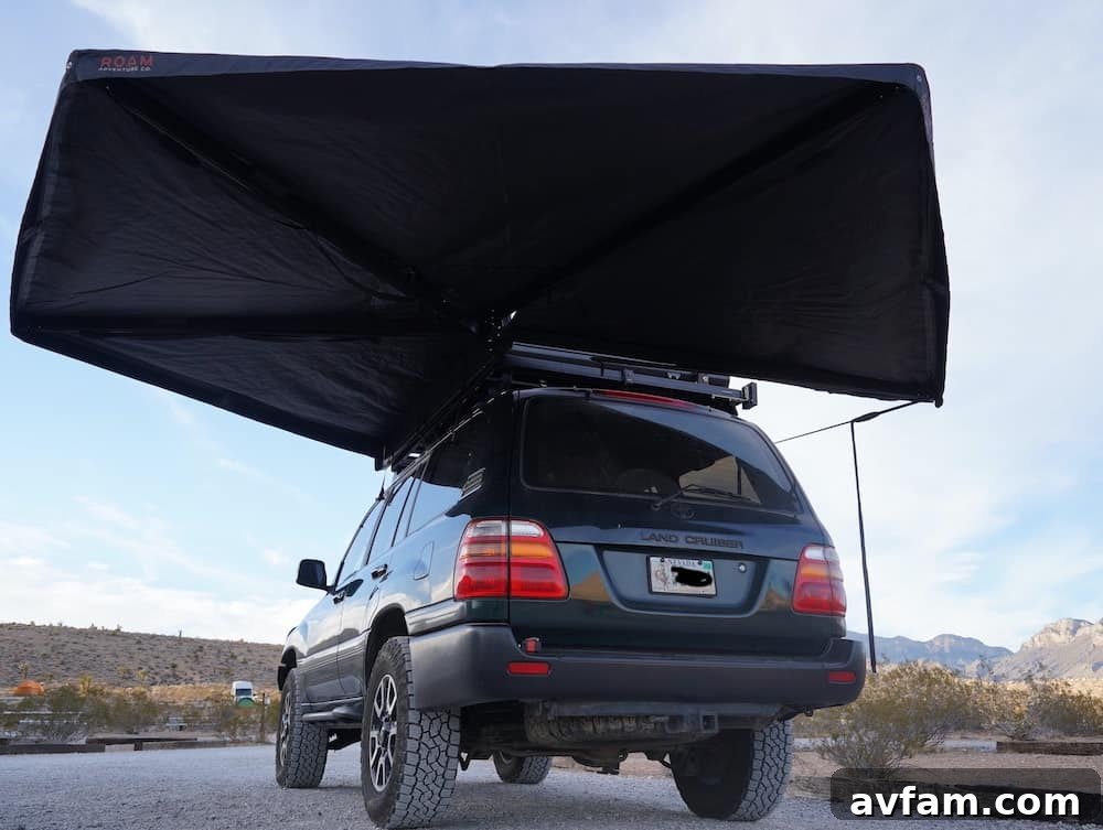 Roam ARC 270 awning deployed with stability legs and guylines for added support
