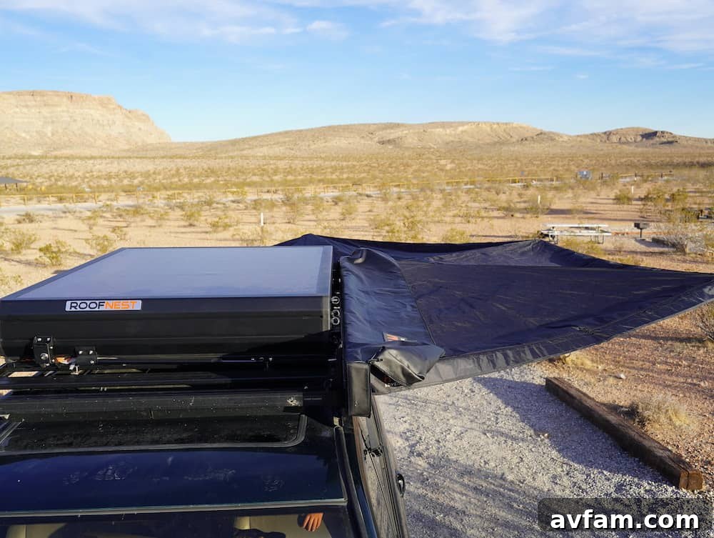Another view of the Roam ARC 270 awning in a relaxed camp setting