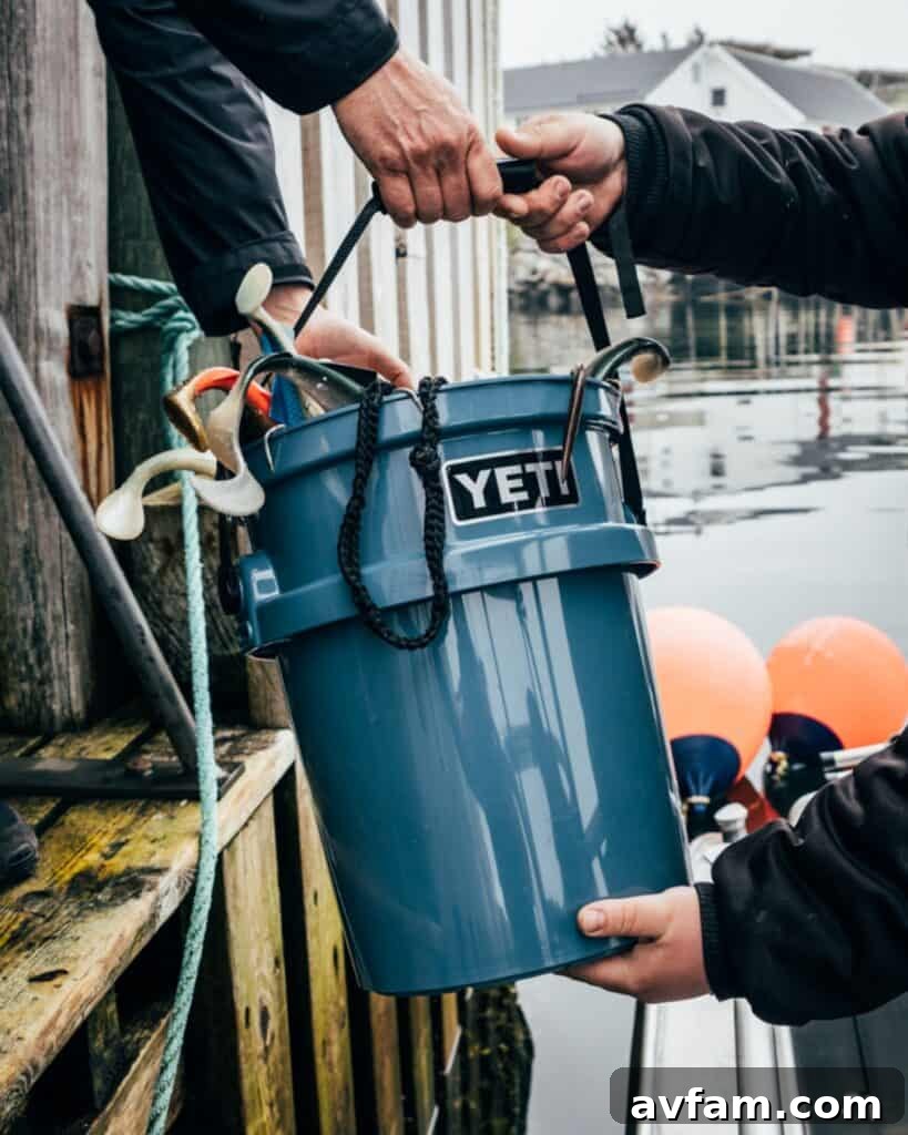 YETI Loadout Bucket A YETI Loadout bucket, heavy-duty and versatile, shown with various outdoor gear, emphasizing its utility.