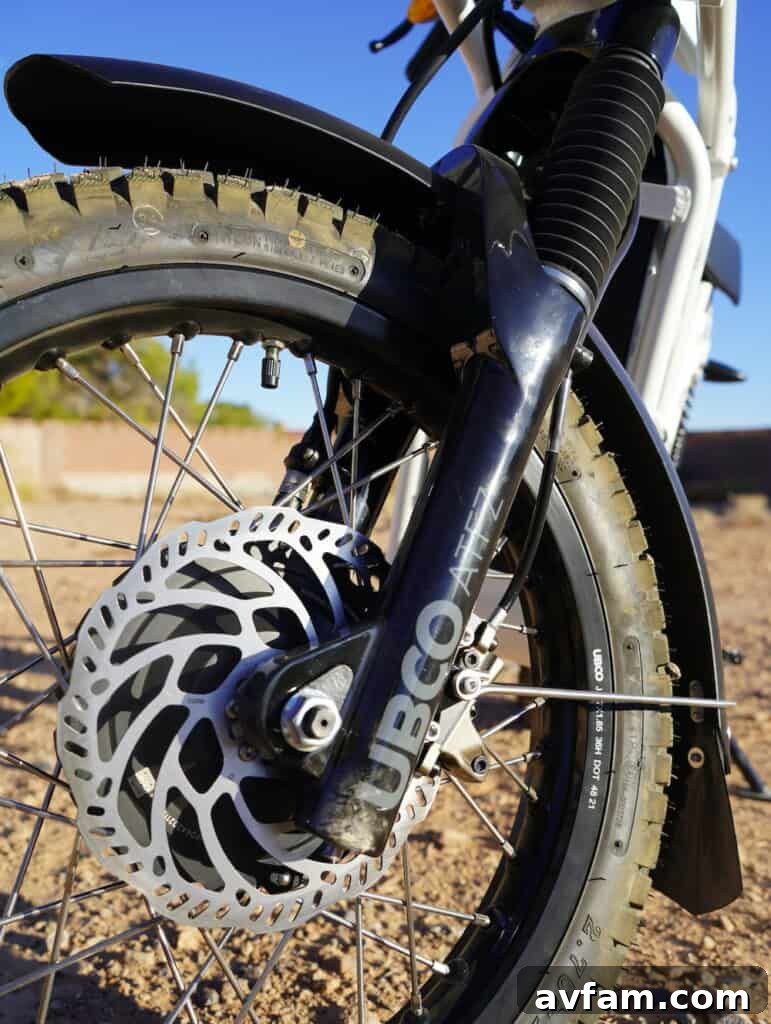 Close-up of UBCO 2x2 electric bike's front wheel and suspension