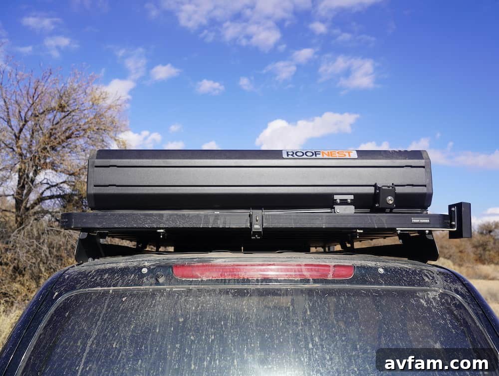 Installing the Condor Overland Two people installing the Roofnest Condor Overland onto a vehicle's roof rack