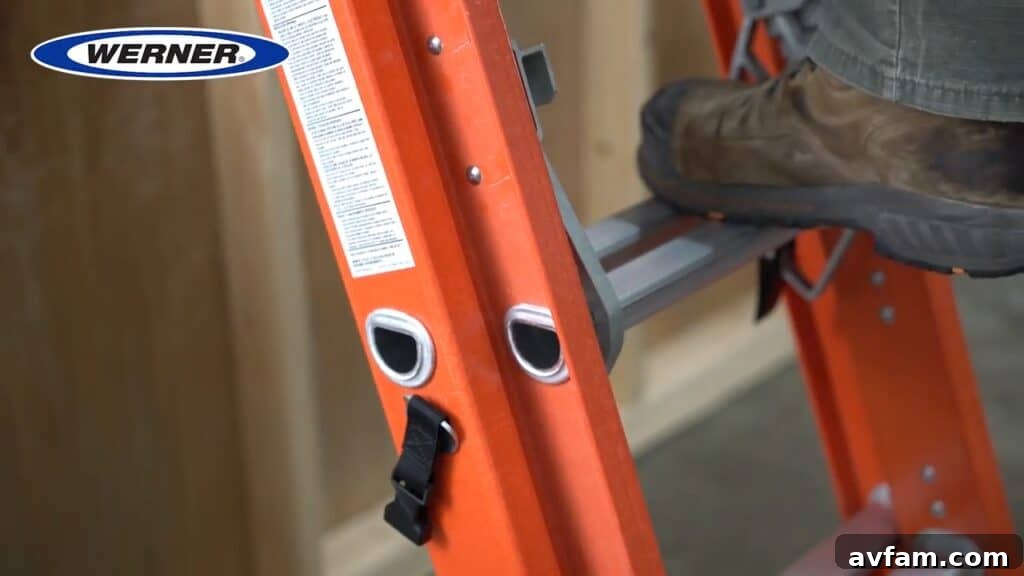 Werner Ladder in Use A person safely ascending a Werner step ladder to reach a high shelf, demonstrating the ladder's stability and design for secure usage.