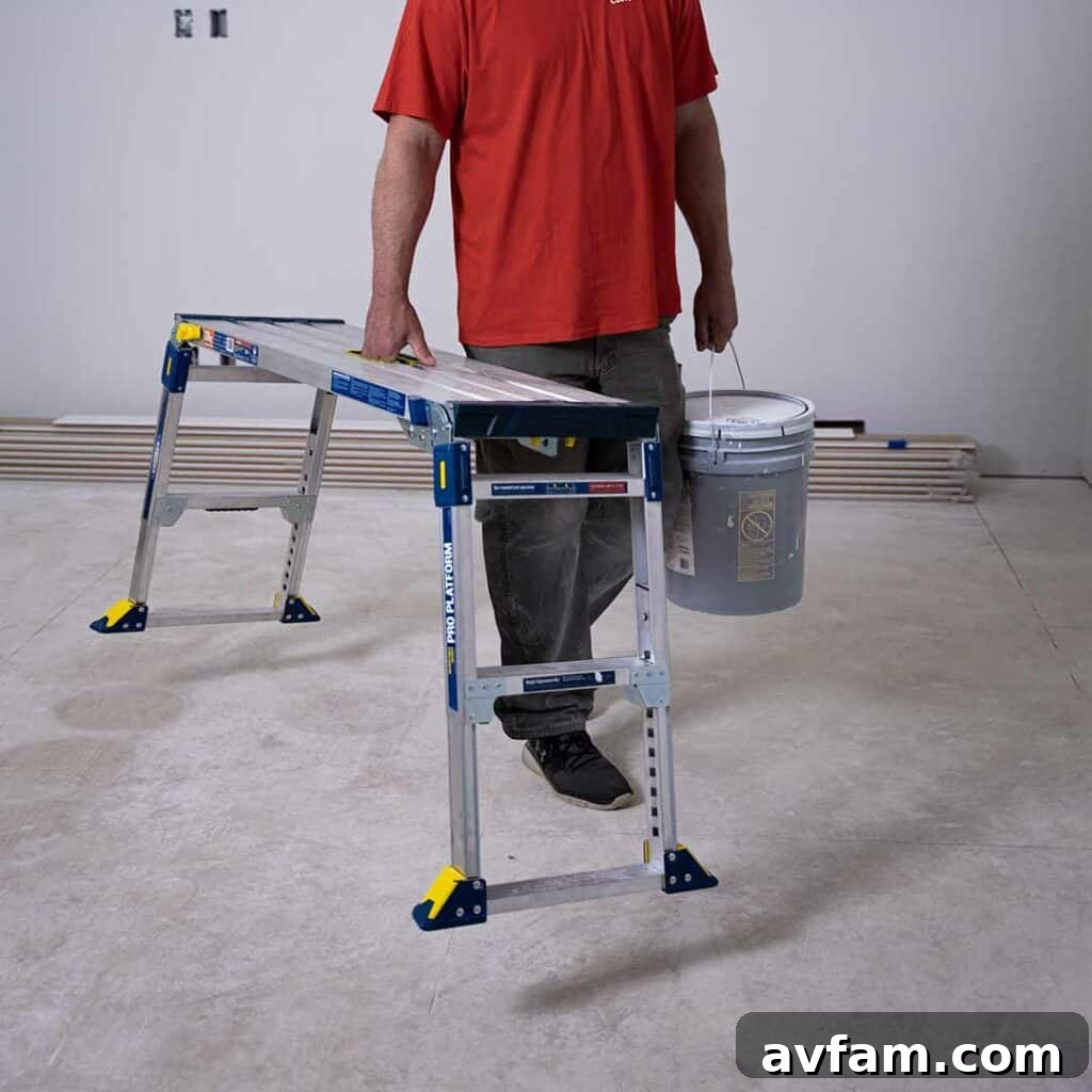 Easy-to-Use Ladder A person easily carrying a lightweight Werner ladder, emphasizing its portability and user-friendly design for effortless transport.