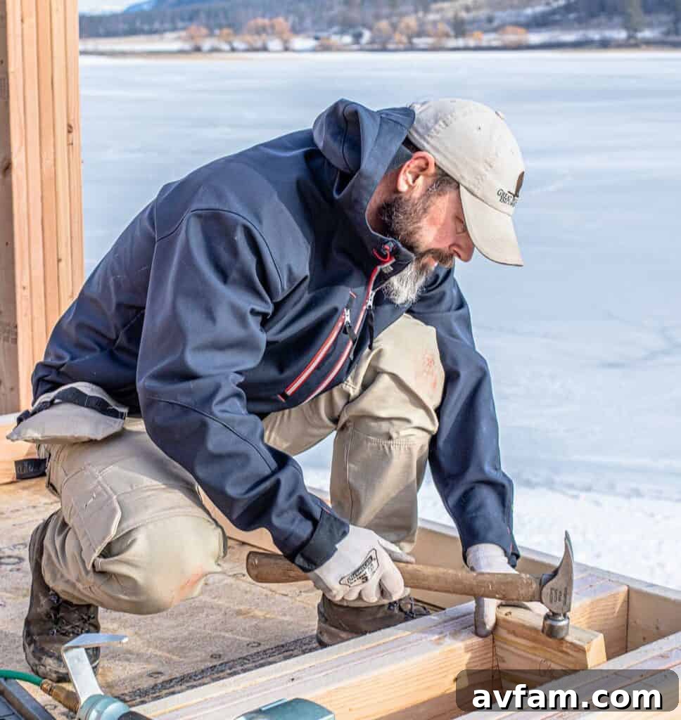 Professional wearing Blaklader work jacket and pants in a workshop setting, showcasing practical design and durability.