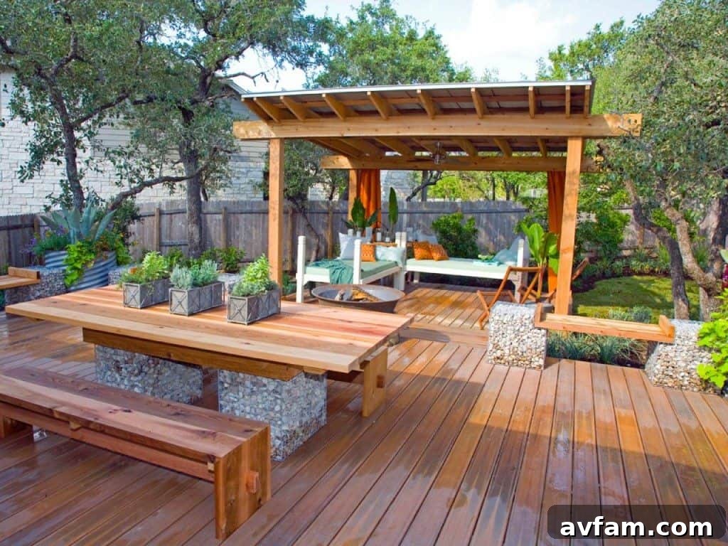 A beautifully designed outdoor living space with a modern patio, comfortable seating, and lush landscaping, perfect for summer entertainment and relaxation.