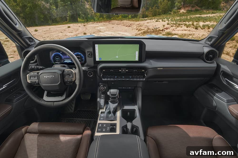 2024 Toyota Land Cruiser Infotainment System Detailed shot of the 2024 Toyota Land Cruiser's interior, focusing on the 12.3-inch multimedia display and dashboard layout.