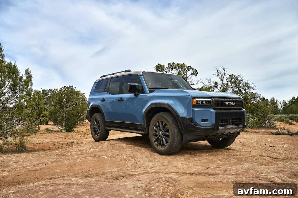 2024 Toyota Land Cruiser Dynamic Shot Dynamic shot of the 2024 Toyota Land Cruiser on an unpaved road, emphasizing its off-road capability.