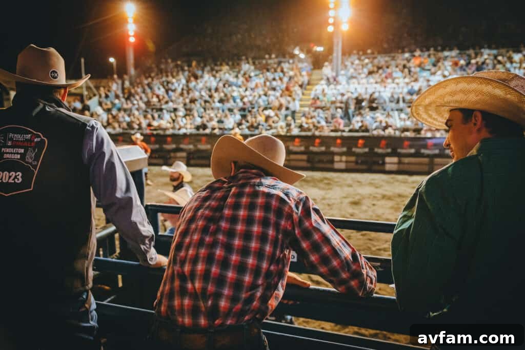 Arena Scene A wide shot of the rodeo arena with multiple riders and horses preparing for an event