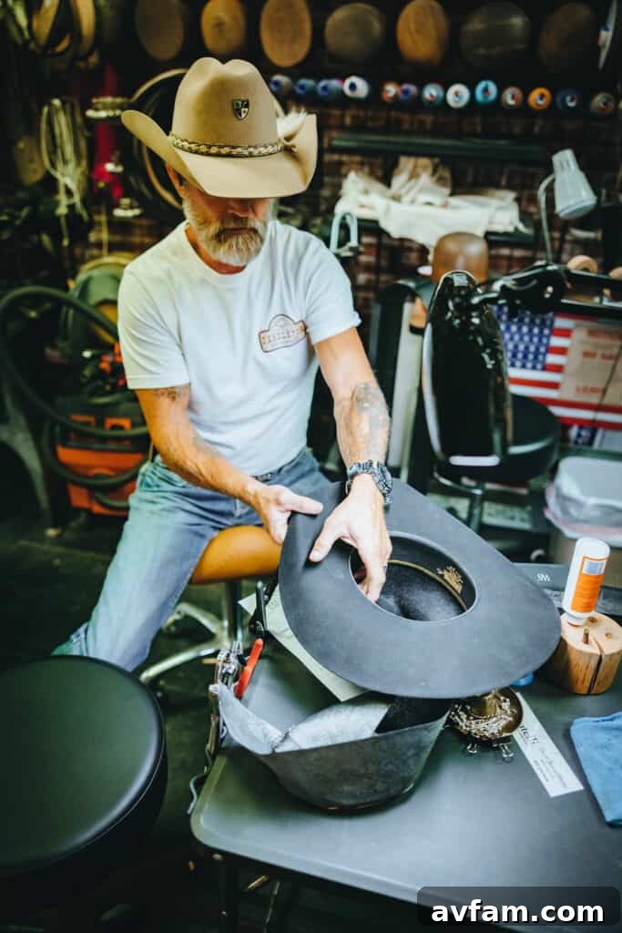 Embracing the Cowboy Spirit Close-up of a person wearing a custom-fitted cowboy hat and a buckle, ready for the rodeo